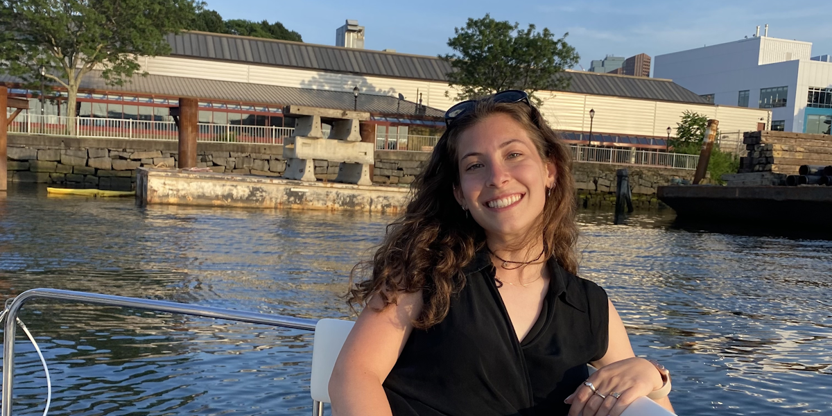 Lauren smiling outdoors while studying in Edinburgh